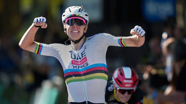 Slovenia's Tadej Pogacar, right, celebrates as he crosses the finish line to win the fourth stage of the Tour de France cycling race over 172.2 kilometers (107 miles) with start in Amiens and finish in Rouen, France, Tuesday, July 8, 2025. (Mosa'ab Elshamy/AP)