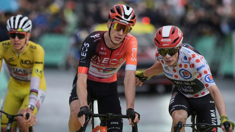 Netherlands' Thymen Arensman, centre crosses the finish line ahead of Denmark's Jonas Vingegaard, wearing the best climber's dotted jersey, and Slovenia's Tadej Pogacar, wearing the overall leader's yellow jersey, to win the nineteenth stage of the Tour de France cycling race over 93.1 kilometres (57.85 miles) with start in Albertville and finish in La Plagne, France, Friday, July 25, 2025. (Thibault Camus/AP)