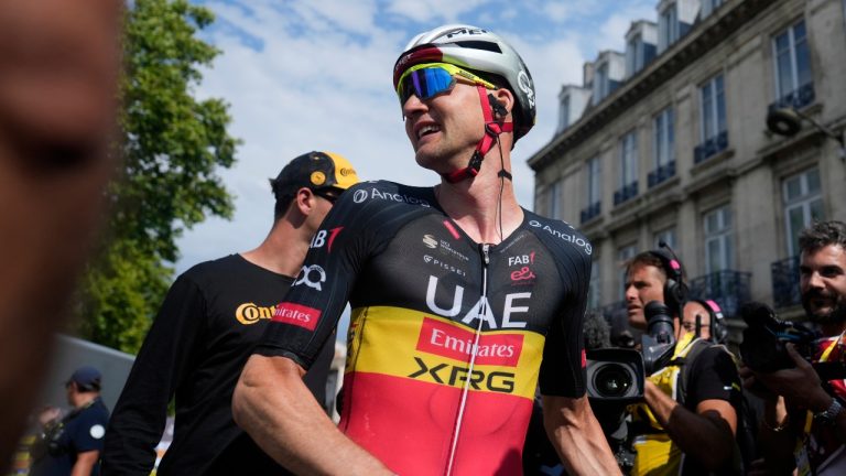 Stage winner Belgium's Tim Wellens celebrates after crossing the finish line of the fifteenth stage of the Tour de France cycling race over 169.3 kilometers (105.2 miles) with start in Muret and finish in Carcassonne, France, Sunday, July 20, 2025. (Mosa'ab Elshamy/ Pool/AP)