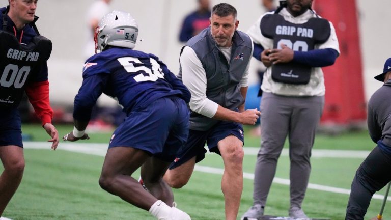 New England Patriots head coach Mike Vrabel, right, runs a drill during the NFL football team's rookie minicamp, Friday, May 9, 2025, in Foxborough, Mass. (Charles Krupa/AP)