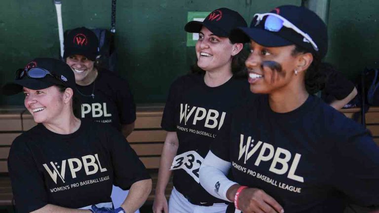 Lauren Boden, second from right, Stephanie Everett, right, and other players talk in the dugout during the first day of tryouts for the Women's Professional Baseball League, Friday, Aug 22, 2025, at the Washington Nationals Youth Baseball Academy in Washington. (Julia Demaree Nikhinson/AP)