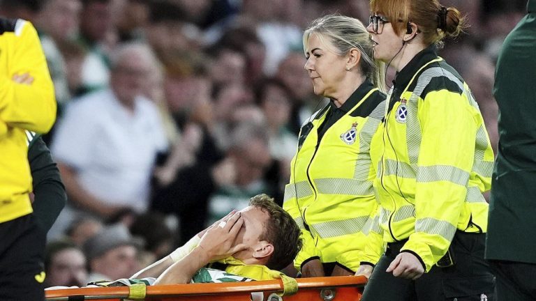 Celtic's Alistair Johnston leaves the field on a stretcher after going down injured against during the UEFA Champions League playoff first leg soccer match at Celtic Park, Wednesday, Aug. 20, 2025, in Glasgow, Scotland. (Andrew Milligan/PA via AP)
