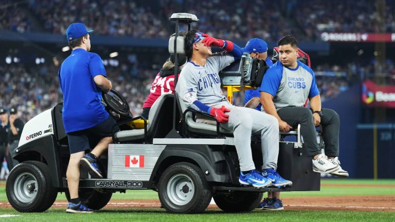 Chicago Cubs catcher Miguel Amaya (9) leaves the game with an injury during eighth inning MLB baseball action against the Toronto Blue Jays in Toronto on Wednesday, August 13, 2025. (Nathan Denette/CP)