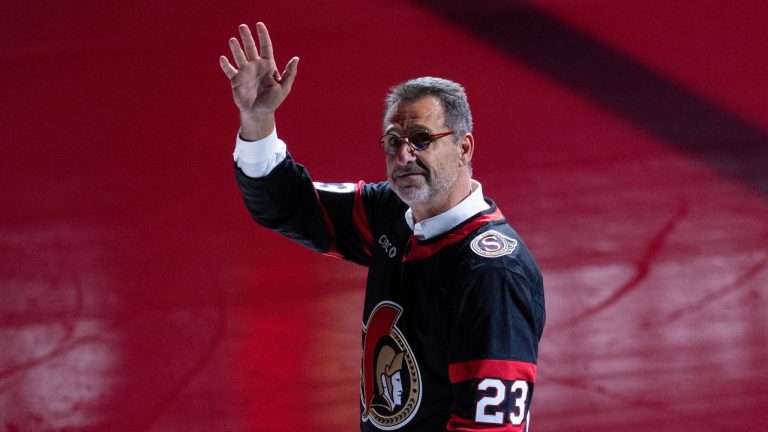 New Ottawa Senators owner Michael Andlauer waves to fans as he makes his way to the ceremonial face-off as the Ottawa Senators play their first home game against the Philadelphia Flyers before NHL action, Saturday, October 14, 2023 in Ottawa. (Adrian Wyld/CP)