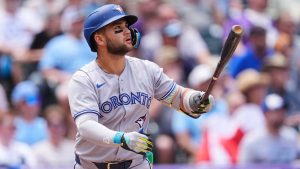 Toronto Blue Jays' Bo Bichette follows the flight of his three-run home run off Colorado Rockies pitcher Kyle Freeland in the third inning of a baseball game Wednesday, Aug. 6, 2025, in Denver. (David Zalubowski/AP)