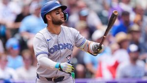 Toronto Blue Jays' Bo Bichette follows the flight of his three-run home run off Colorado Rockies pitcher Kyle Freeland in the third inning of a baseball game Wednesday, Aug. 6, 2025, in Denver. (David Zalubowski/AP)