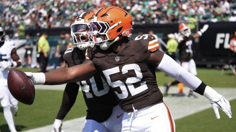 Cleveland Browns defensive end KJ Henry (52) celebrates his interception for a touchdown with Browns linebacker Nathaniel Watson (40) during the second half of an NFL preseason football game against the Philadelphia Eagles on Saturday, Aug. 16, 2025, in Philadelphia. (Chris Szagola/AP)