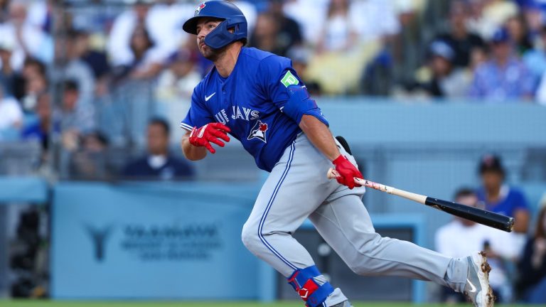 Toronto Blue Jays' Buddy Kennedy follows through on a double during the third inning of a baseball game against the Los Angeles Dodgers, Saturday, Aug. 9, 2025, in Los Angeles. (Jessie Alcheh/AP)