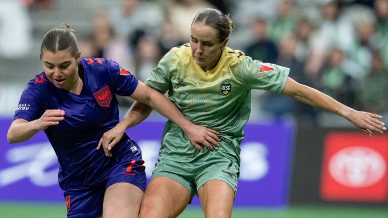 Calgary Wild's Caleigh Boeckx and Vancouver Rise's Nicole Stanton vie for the ball during the second half of an NSL match in Vancouver on Wednesday, April 16, 2025. THE CANADIAN PRESS/Ethan Cairns