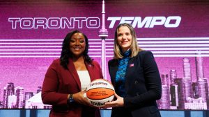Newly-named general manager Monica Wright Rogers (left) and Teresa Resch, president of the Toronto Tempo, pose with a basketball at a WNBA Toronto Tempo team announcement in Toronto, Thursday, Feb. 20, 2025. THE CANADIAN PRESS/Cole Burston