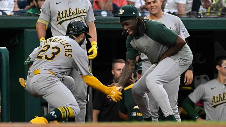 Athletics' Shea Langeliers (23) is greeted by Lawrence Butler, right, after hitting a home run against Washington Nationals pitcher MacKenzie Gore during the first inning of a baseball game in Washington, Tuesday, Aug. 5, 2025. (Terrance Williams/AP)
