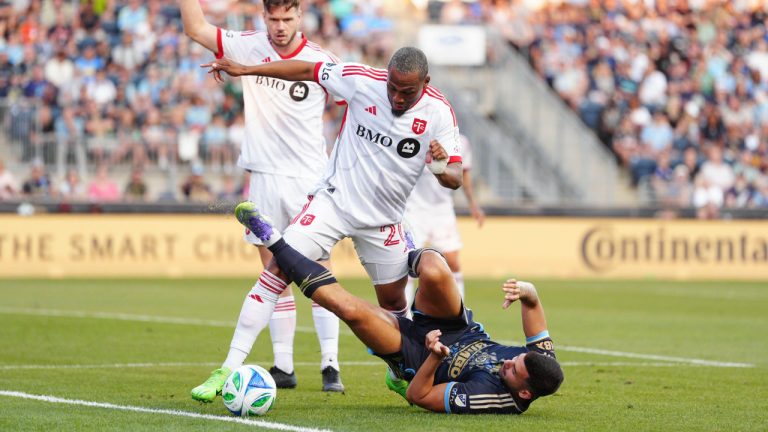 Toronto FC's Deybi Flores and Philadelphia Union's Tai Baribo, bottom, battle for the ball during the first half of an MLS soccer match, Saturday, Aug. 9, 2025, in Chester, Pa. (Derik Hamilton/AP)
