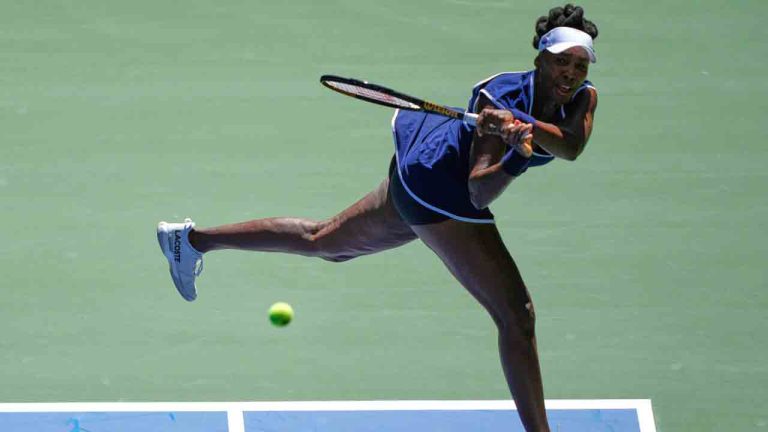 Venus Williams returns a shot during the mixed doubles competition of the U.S. Open tennis tournament in New York, Tuesday, Aug. 19, 2025. (Yuki Iwamura/AP)