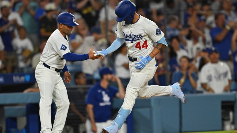 Los Angeles Dodgers' Andy Pages is greeted by third base coach/outfield coach Dino Ebel after hitting a two-run home run during the fifth inning of a game against the Cincinnati Reds Monday, Aug. 25, 2025, in Los Angeles. (Jayne Kamin-Oncea/AP)
