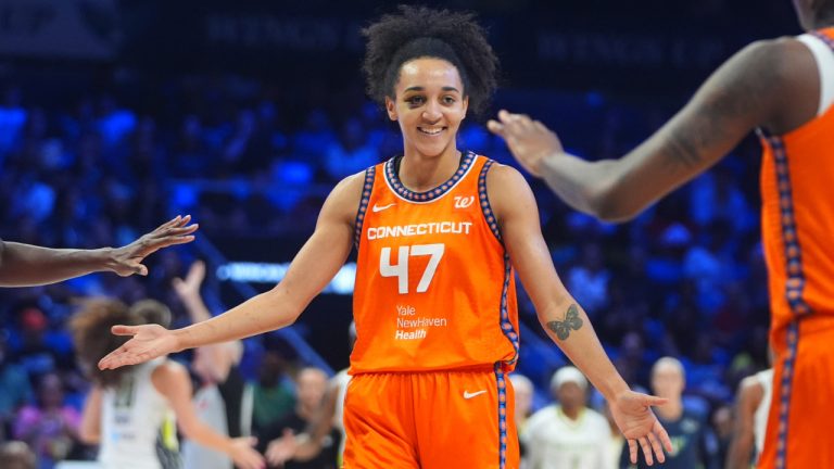 Connecticut Sun guard Leila Lacan celebrates a play with teammates center Tina Charles and guard Saniya Rivers during the second half of a WNBA game against the Dallas Wings in Arlington, Texas, Wednesday, Aug. 27, 2025. (LM Otero/AP)