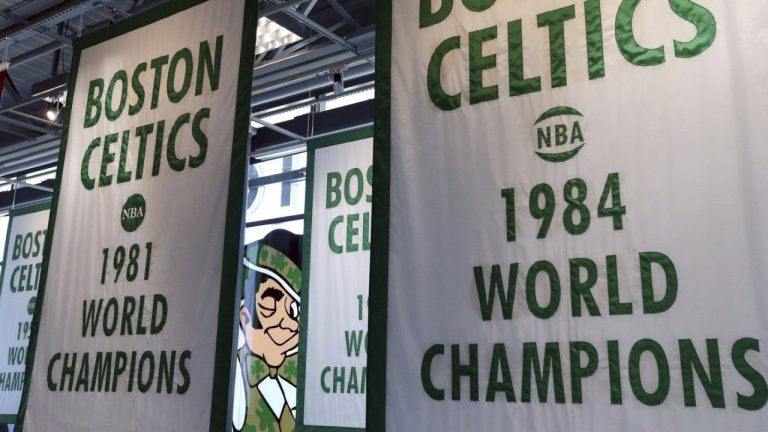 Lucky the Leprechaun, the Boston Celtics team logo, peers out from in between Celtics championship banners hanging in their new basketball team practice facility, Tuesday, June 19, 2018, in Boston. (Elise Amendola/AP)