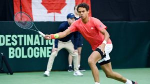 Gabriel Diallo, of Canada, plays a shot to Fabian Marozsan, of Hungary, during their Davis Cup qualifying tennis match in Montreal on Sunday, February 2, 2025. (Graham Hughes/CP)
