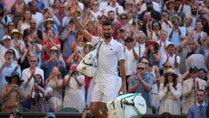 Serbia's Novak Djokovic leaves the court after losing to Italy's Jannik Sinner in a men's singles semifinal at the Wimbledon Tennis Championships in London, Friday, July 11, 2025. (Kin Cheung/AP)