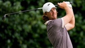 Tommy Fleetwood, of England, hits from the 12th tee during the third round of the Tour Championship golf tournament, Saturday, Aug. 23, 2025, in Atlanta. (AP Photo/Mike Stewart)
