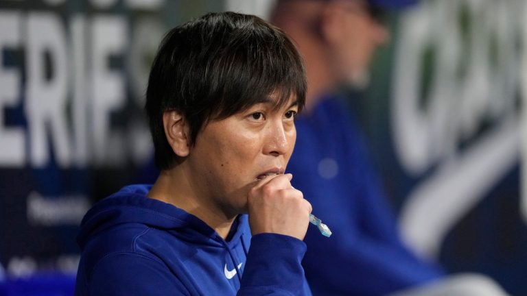 Interpreter Baseball
Los Angeles Dodgers designated hitter Shohei Ohtani's interpreter Ippei Mizuhara stands in the dugout during an opening day baseball game against the San Diego Padres at the Gocheok Sky Dome in Seoul, South Korea Wednesday, March 20, 2024. Ohtani’s interpreter and close friend has been fired by the Dodgers following allegations of illegal gambling and theft from the Japanese baseball star. (Lee Jin-man/AP)
