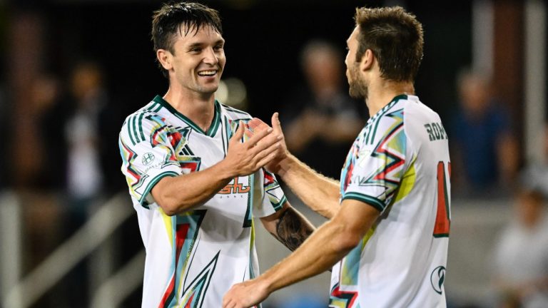 San Jose Earthquakes's Preston Judd, left, and Dave Romney celebrate after defeating the Vancouver Whitecaps after an MLS soccer match Saturday, Aug. 9, 2025, in San Jose, Calif. (Thien-An Truong/AP)