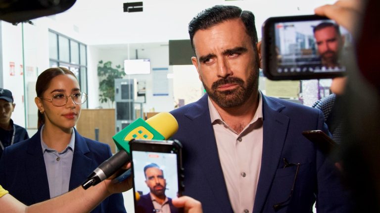 Alejandra Payan, left, and Ruben Benitez, right, lawyers for boxer Julio César Chávez Jr., speak to the press after the hearing to determine his legal status in Hermosillo, Mexico, Saturday, Aug. 23, 2025. (AP Photo/Abraham Tellez)