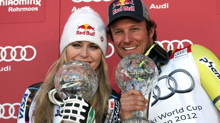 Lindsey Vonn, of the United States, left, and Norway's Aksel Lund Svindal pose with their trophies of the alpine ski, women's and men's World Cup super-G discipline titles, in Schladming, Austria, Thursday, March 15, 2012. (AP Photo/Alessandro Trovati)