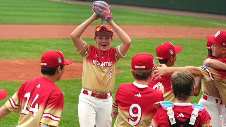 Las Vegas, Nev.'s Banks Mossler (8) celebrates with teammates after getting the final out of the United States Championship baseball game against Fairfield, Conn. at the Little League World Series tournament in South Williamsport, Pa., Saturday, Aug. 23, 2025. (Gene J. Puskar/AP)