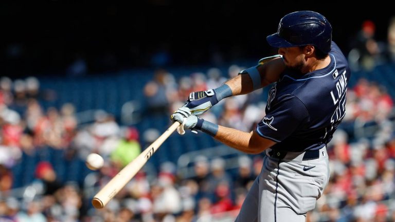 Tampa Bay Rays' Josh Lowe hits a three-run home run against Washington Nationals pitcher Jake Irvin, which scored Brandon Lowe and Junior Caminero, during the first inning of a baseball game, Saturday, Aug. 30, 2025, in Washington. (Terrance Williams/AP)