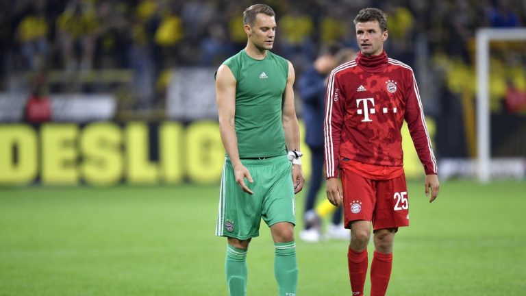 Bayern goalkeeper Manuel Neuer, left, and Bayern's Thomas Muller react after the German Supercup final soccer match between Borussia Dortmund and Bayern Munich in Dortmund, Germany, Saturday, Aug. 3, 2019. (Martin Meissner/AP)