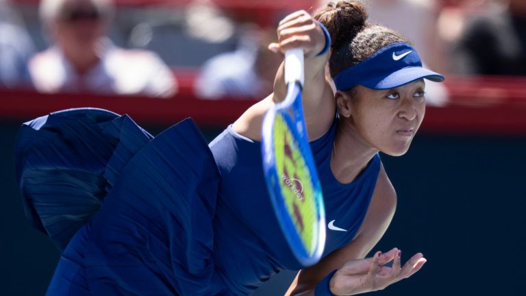 Naomi Osaka of Japan serves to Jelena Ostapenko of Latvia during third round tennis action at the National Bank Open in Montreal, Friday, Aug. 1, 2025. (Christinne Muschi/CP)