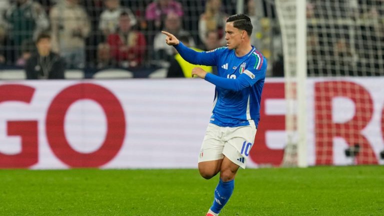 Italy's Giacomo Raspadori celebrates after scoring his side's third goal during the Nations League quarterfinal second leg soccer match between Germany and Italy at the Signal-Iduna Park in Dortmund, Germany, Sunday, March 23, 2025. (Martin Meissner/AP)