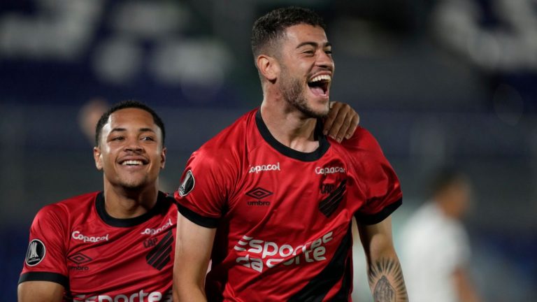 Romulo of Brazil's Athletico Paranaense, center, celebrates scoring his side's opening goal followed by teammate Vitor Roque against Paraguay's Libertad during a Copa Libertadores Group G soccer match at Defensores del Chaco stadium in Asuncion, Paraguay, Thursday, May 4, 2023. (Jorge Saenz/AP)