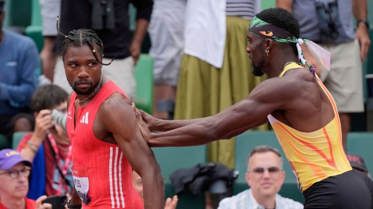 Kenny Bednarek pushes Noah Lyles after the men's 200-metre finals during the U.S. Championships athletics meet in Eugene, Ore., Sunday, Aug. 3, 2025. (Ashley Landis/AP)