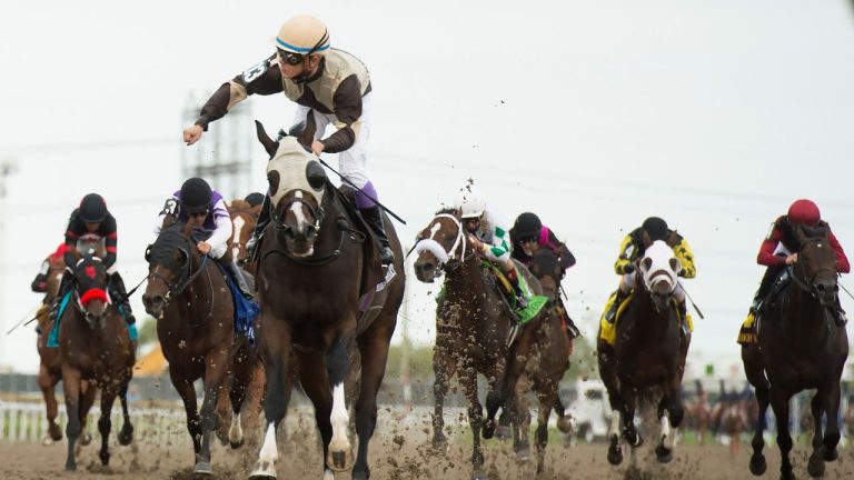 Mighty Heart with jockey Daisuke Fukumoto rides to victory during the running of the 161st Queen's Plate at Woodbine Racetrack in Toronto on Saturday, Sept. 12, 2020. (CP/Nathan Denette)