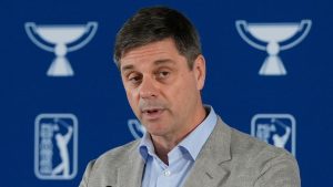 PGA Tour CEO Brian Rolapp speaks before a practice round of the Tour Championship golf tournament, Aug. 20, 2025, in Atlanta. (AP Photo/Mike Stewart, File)