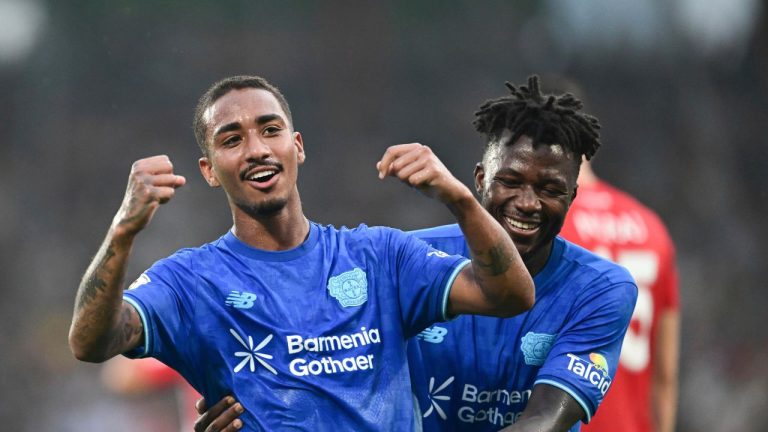 Leverkusen's Arthur celebrates scoring with Edmond Tapsoba, right, during the DFB Cup 1st round soccer match between SG Sonnenhof Großaspach and Bayer Leverkusen at WIRmachenDRUCK Arena, Aspach, Germany, Aug. 15, 2025. (Bernd Weißbrod/dpa via AP)