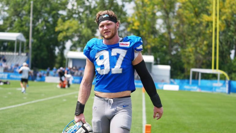 Dolphins Lions Football
Detroit Lions defensive end Aidan Hutchinson walks off the field during a joint NFL football training camp with the Miami Dolphins, Aug. 13, 2025, in Allen Park, Mich. (AP Photo/Ryan Sun)