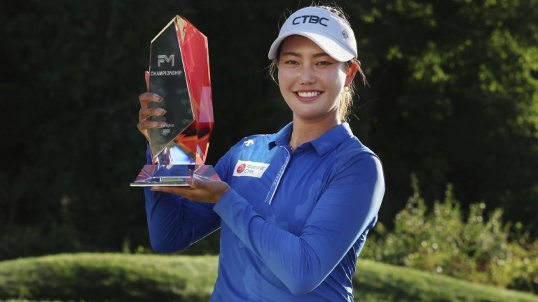 Miranda Wang, of China, holds the trophy after winning the FM Championship LPGA golf tournament at TPC Boston, Sunday, Aug. 31, 2025, in Norton, Mass. (AP/Michael Dwyer)