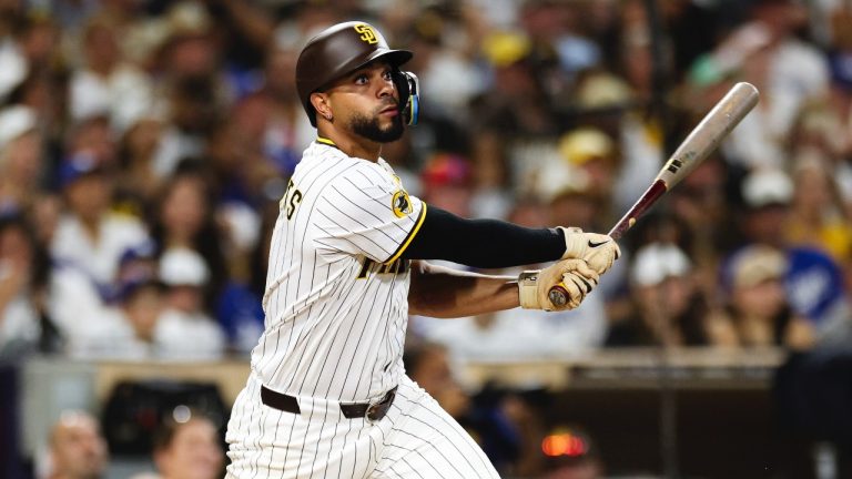 San Diego Padres' Xander Bogaerts watches his two-RBI double against the Los Angeles Dodgers in the eighth inning of a baseball game Saturday, Aug. 23, 2025, in San Diego. (AP/Derrick Tuskan)