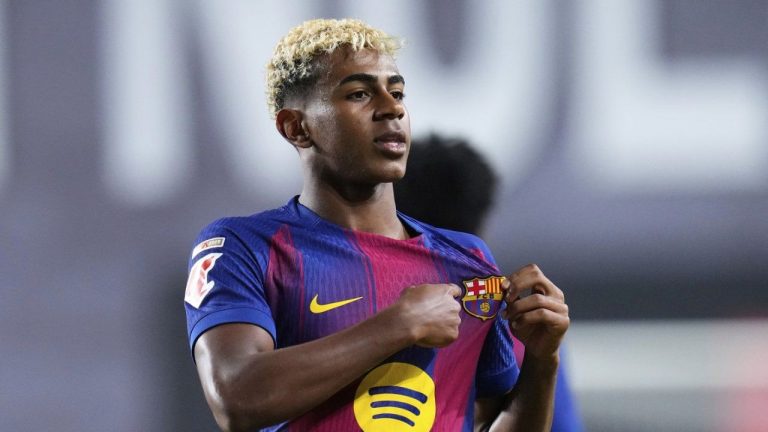 Barcelona's Lamine Yamal celebrates after scoring the opening goal from the penalty spot during the Spanish La Liga soccer match between Rayo Vallecano and FC Barcelona at the Vallecas stadium in Madrid, Spain, Sunday, Aug. 31, 2025. (Manu Fernandez/AP)