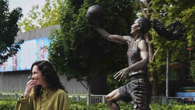 Former Seattle Storm WNBA basketball point guard Sue Bird stands near her statue after its unveiling outside Climate Pledge Arena, Sunday, Aug. 17, 2025, in Seattle. (Lindsey Wasson/AP)