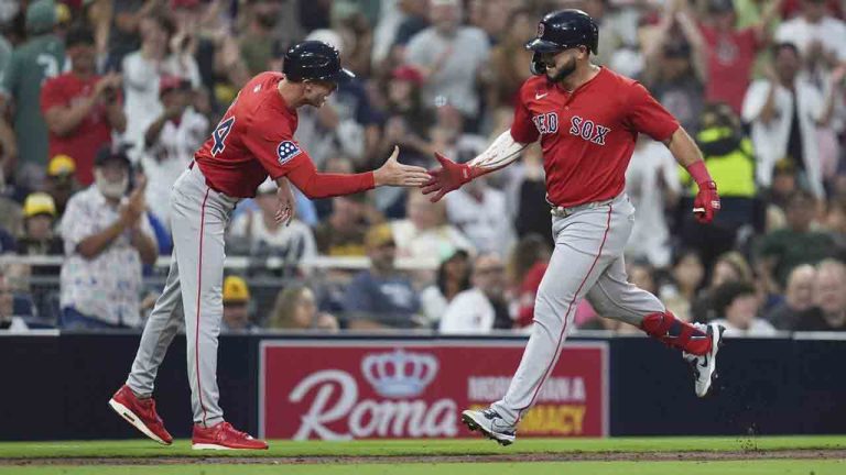 Boston Red Sox's Wilyer Abreu, right, celebrates his two-run home run with third base coach Kyle Hudson during the fourth inning of a baseball game against the San Diego Padres Friday, Aug. 8, 2025, in San Diego. (Gregory Bull/AP)