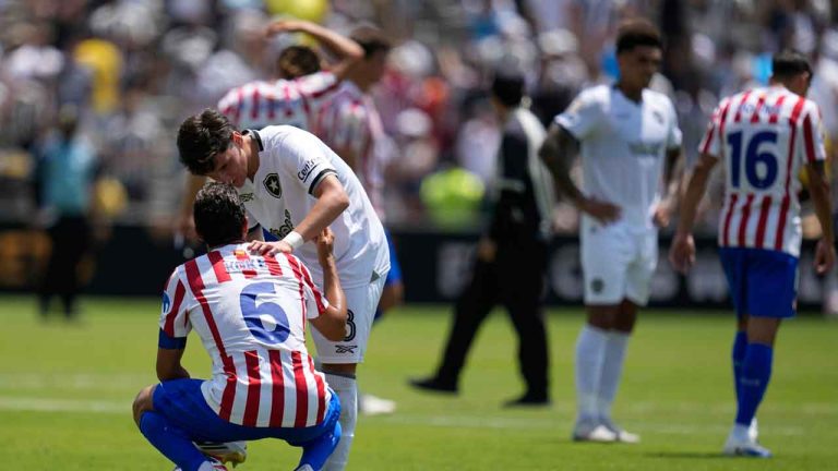 Botafogo's Alvaro Montoro, above, talks to Atletico Madrid's Koke at the end of the Club World Cup Group B soccer match between Atletico Madrid and Botafogo. (Gregory Bull/AP)