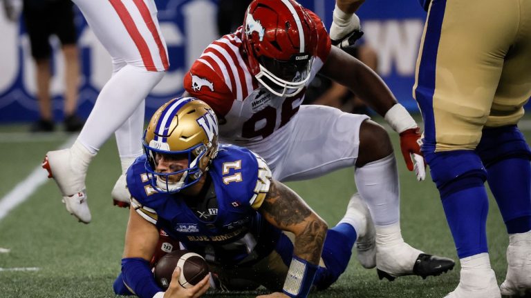 FBO CFL Stampeders Blue Bombers 20250718
Winnipeg Blue Bombers quarterback Chris Streveler (17) gets sacked by Calgary Stampeders' Jaylon Hutchings (96) during second half CFL action in Winnipeg Friday, July 18, 2025. (John Woods/CP)