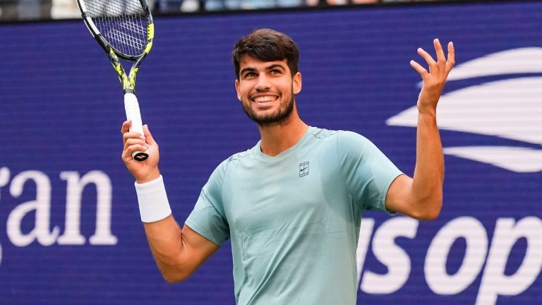 Carlos Alcaraz, of Spain, gestures to fans during a mixed doubles match at the U.S. Open tennis championships, Tuesday, Aug. 19, 2025, in New York. (Yuki Iwamura/AP)