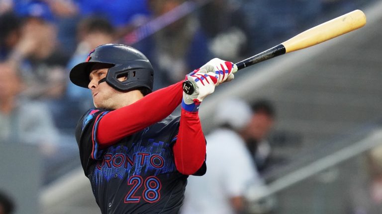 Toronto Blue Jays' Ernie Clement (28) hits a three-run home run against the Cincinnati Reds during third inning interleague MLB baseball action in Toronto on Wednesday, August 21, 2024. (Chris Young/CP)