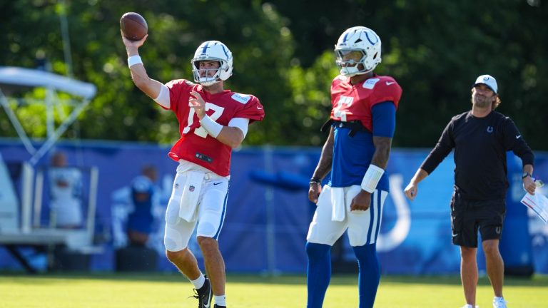 Indianapolis Colts quarterback Anthony Richardson Sr. (5) looks on as Daniel Jones (17) throws during practice at the NFL football team's training camp in Westfield, Ind., Sunday, Aug. 3, 2025. (Michael Conroy/AP)