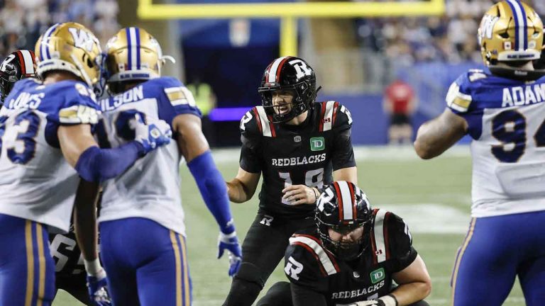 Ottawa Redblacks quarterback Dustin Crum (18) yells to his line during second half CFL action against the Winnipeg Blue Bombers. (John Woods/CP)
