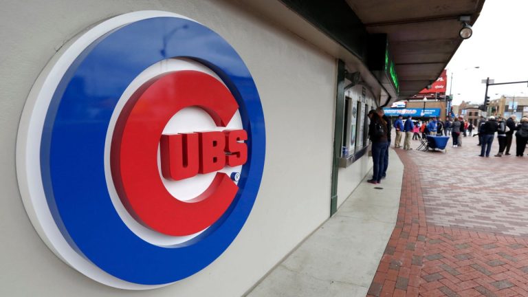 This April 15, 2013, file photo shows the Chicago Cubs logo on the exterior of Wrigley Field, in Chicago. The Chicago Cubs and Sinclair Broadcast Group are launching a regional sports network in 2020 that will be the team’s exclusive TV home. The Cubs said Wednesday, Feb. 13, 2019, the Marquee Sports Network will carry live game broadcasts and pregame and postgame coverage. (M. Spencer Green/AP)